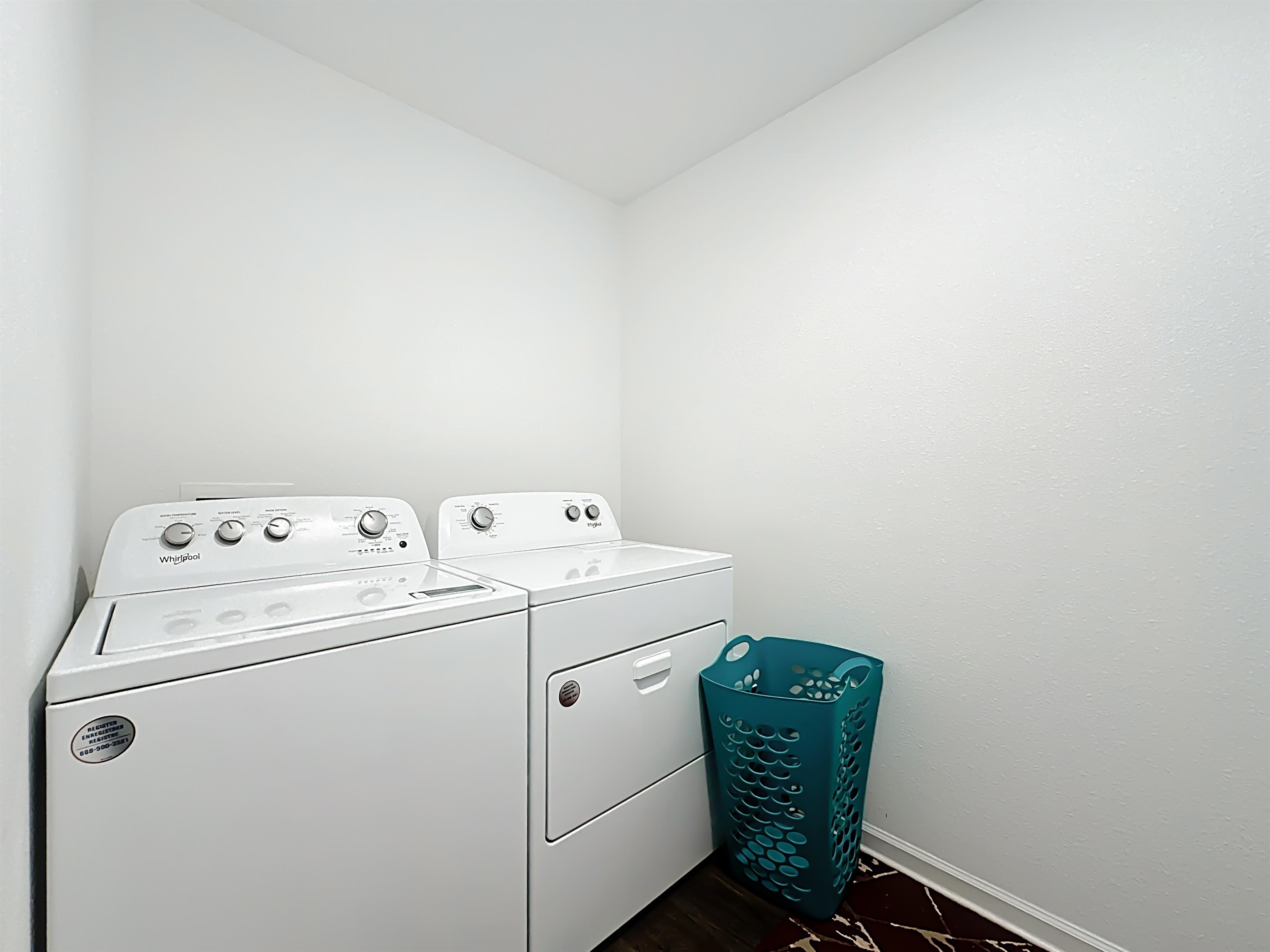 16 Encanto Way Street St. Augustine, FL 32084 - Photo 34 of 56 Laundry area featuring baseboards and washing machine and dryer