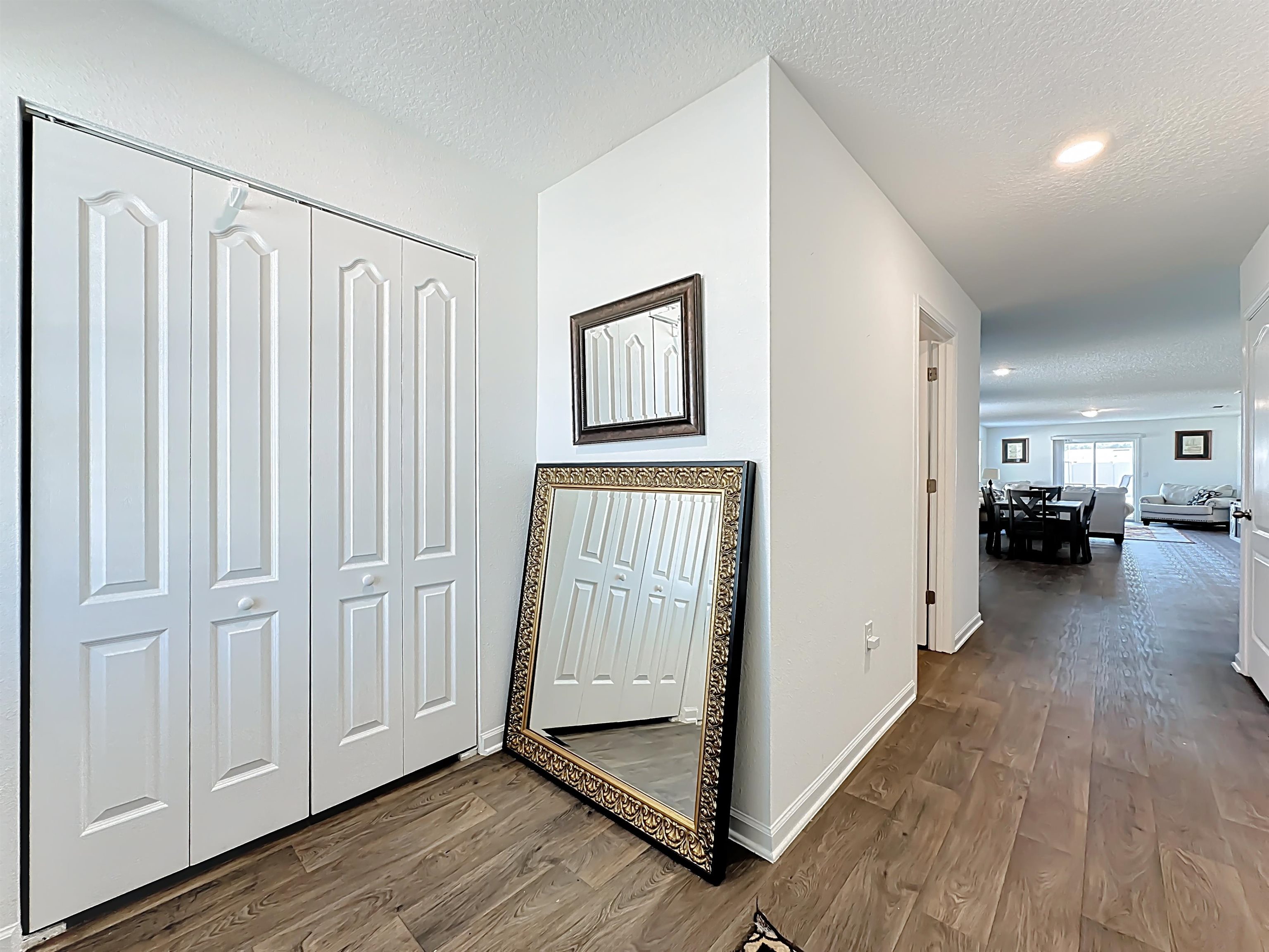 16 Encanto Way Street St. Augustine, FL 32084 - Photo 7 of 56 Hallway with a textured ceiling, dark wood-type flooring, and recessed lighting