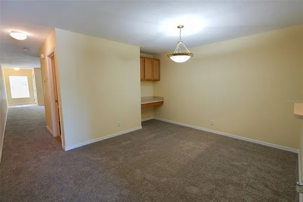 wooden floor in an empty room with a mirror