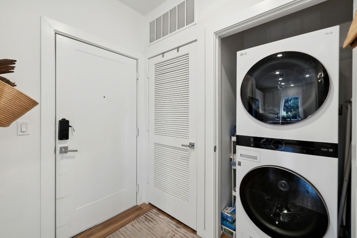 4802 South Congress Avenue, Unit 215 Austin, TX 78745 - Photo 22 of 32 a view of a hallway with washer and dryer