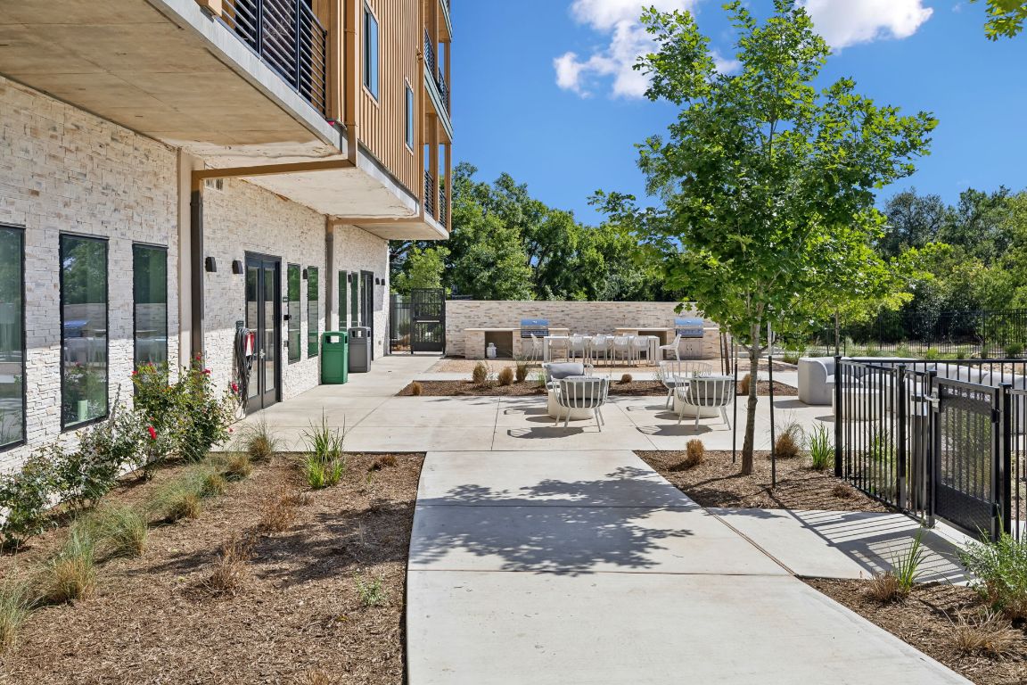 4802 South Congress Avenue, Unit 215 Austin, TX 78745 - Photo 30 of 32 a view of a dinning table and chairs in patio