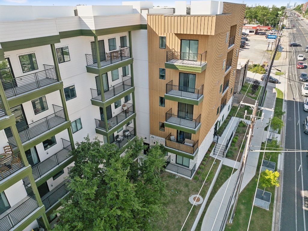 4802 South Congress Avenue, Unit 215 Austin, TX 78745 - Photo 3 of 32 a front view of a multi story building