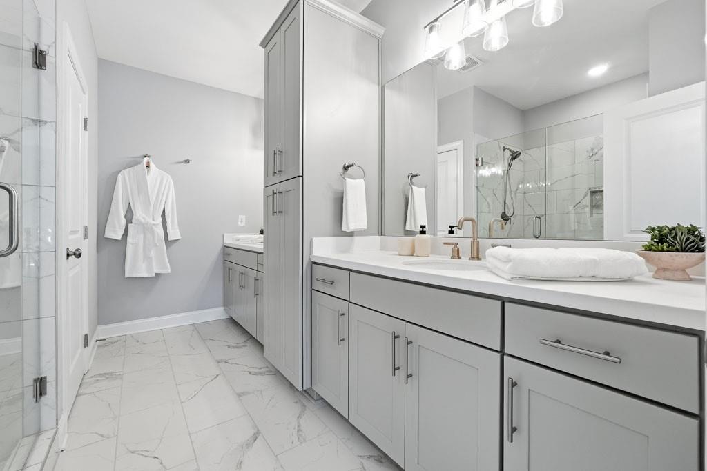 1363 Pavilion Street Southeast Atlanta, GA 30316 - Photo 13 of 25 a spacious bathroom with a double vanity sink a mirror and a shower