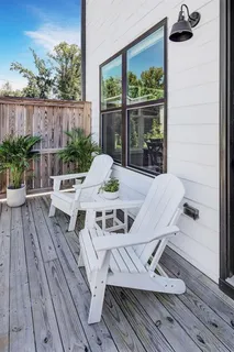 a view of a tables and chairs on the roof deck