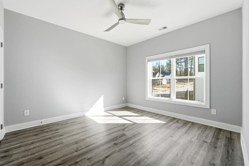 1363 Pavilion Street Southeast Atlanta, GA 30316 - Photo 4 of 25 a view of an empty room with wooden floor and a window