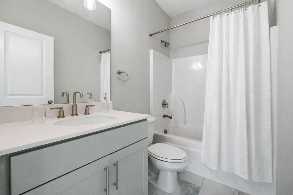 1363 Pavilion Street Southeast Atlanta, GA 30316 - Photo 5 of 25 a bathroom with a sink a toilet and shower