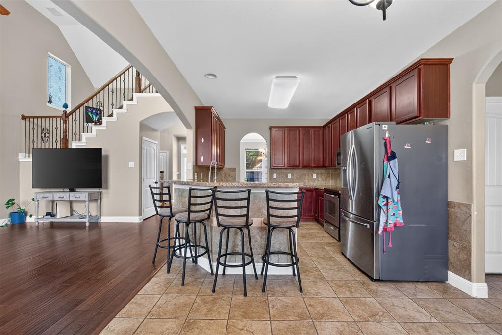 517 Austin Acre Road Sulphur Springs, TX 75482 - Photo 13 of 23 a dining room with furniture and wooden floor