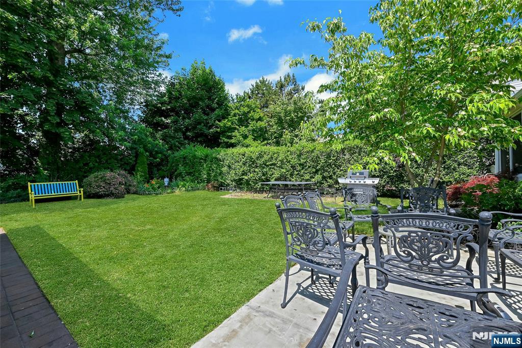 85 Edison Street Clifton, NJ 07013 - Photo 25 of 28 a view of a chairs and table in the garden