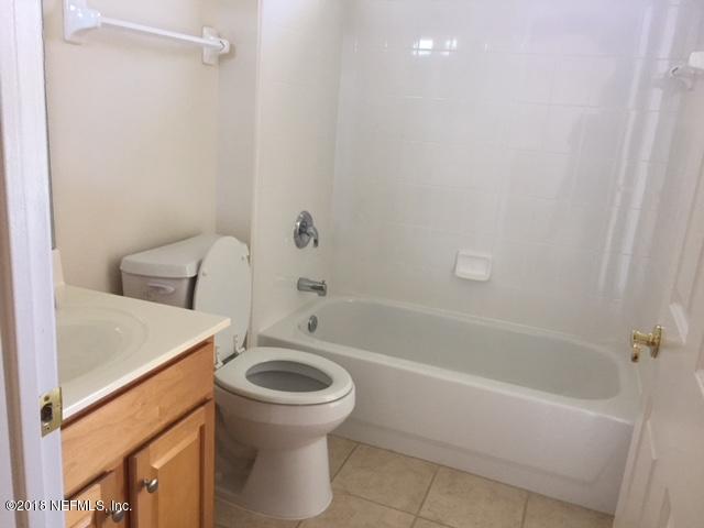 2120 West Quay Road St. Augustine, FL 32092 - Photo 11 of 12 a bathroom with a sink a toilet and bathtub