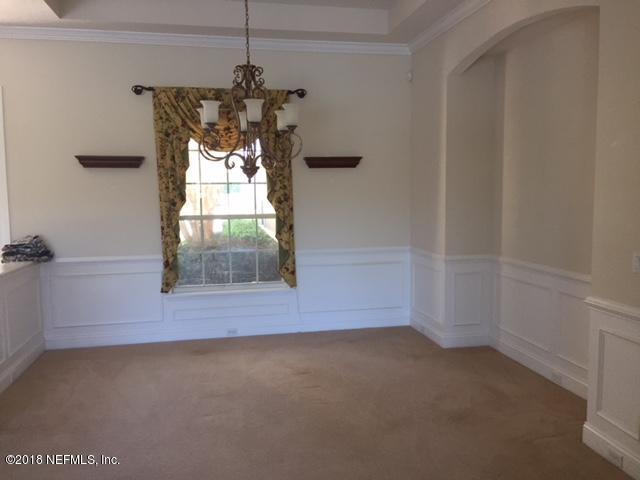 2120 West Quay Road St. Augustine, FL 32092 - Photo 7 of 12 a view of a small space with wooden floor and a window