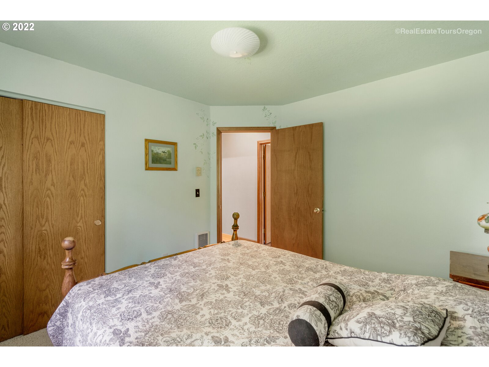 12715 South Casto Road Oregon City, OR 97045 - Photo 20 of 32 a bedroom with a bed and a painting on the wall