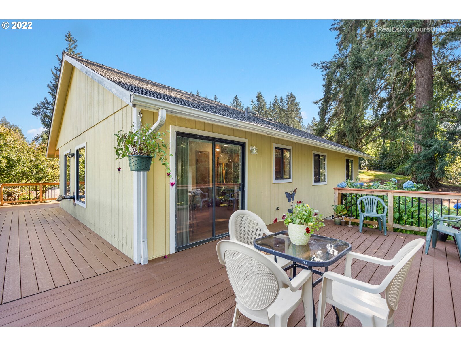 12715 South Casto Road Oregon City, OR 97045 - Photo 25 of 32 a view of a house with backyard and sitting area