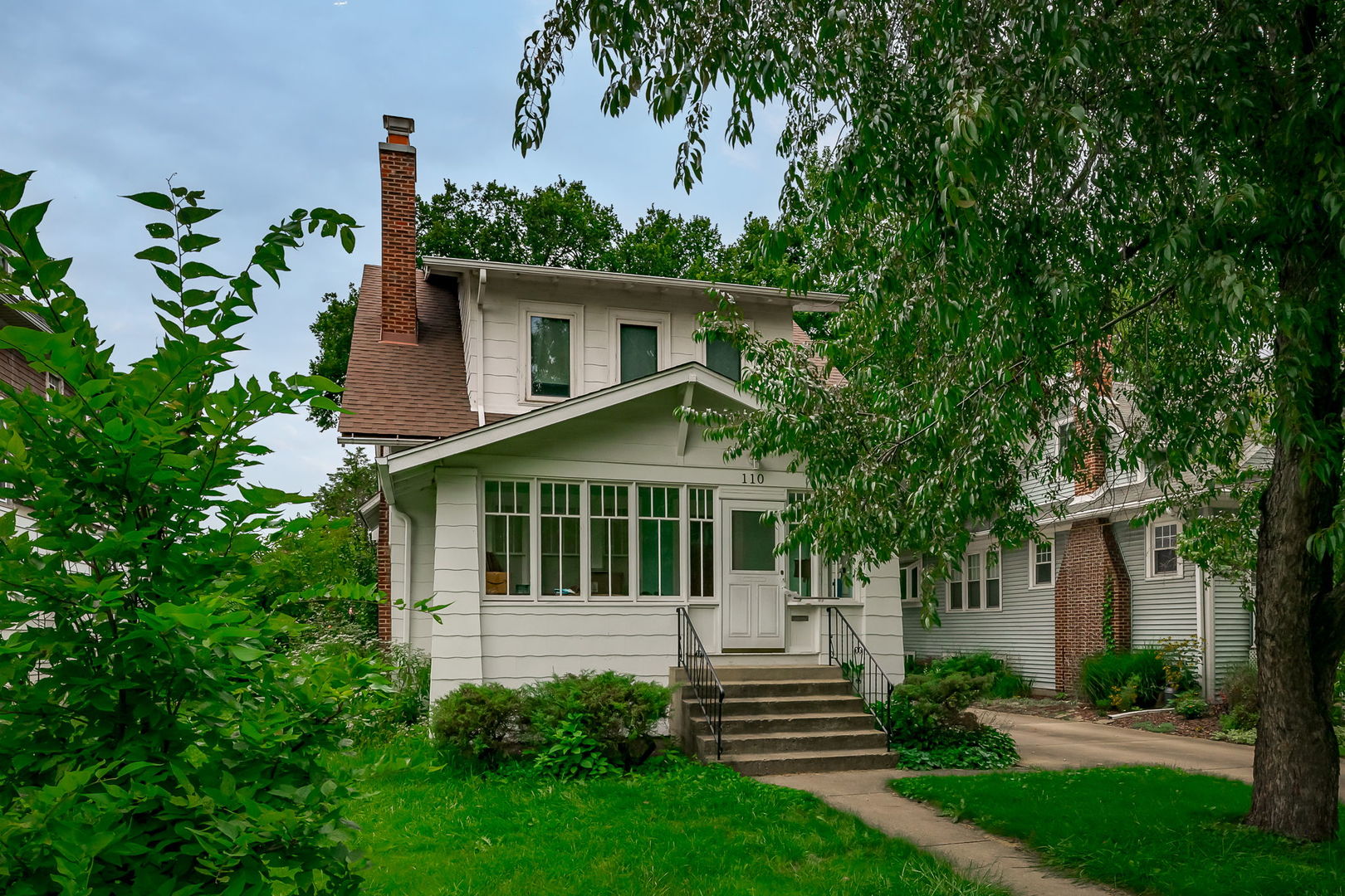 front view of a house with a yard