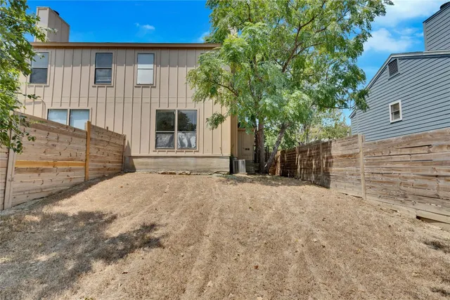 a view of a backyard of the house