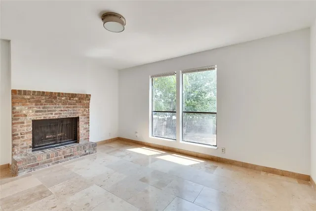 an empty room with fireplace