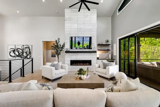 a living room with furniture and a large window