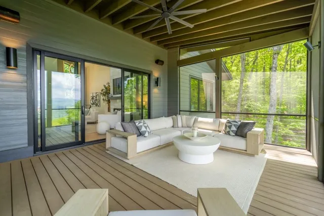 a living room with fireplace furniture and decor