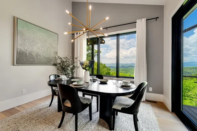 a spacious bedroom with a bed and a lamp