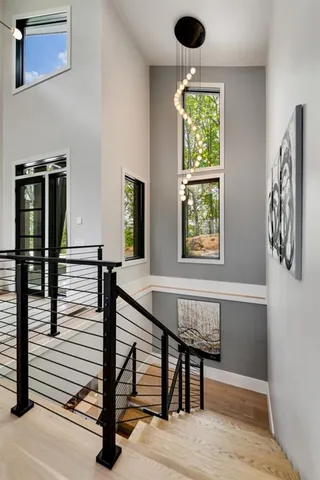 a bathroom with a sink a toilet a shower and a mirror