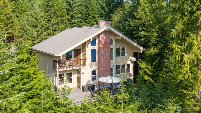 a aerial view of a house with yard and sitting area