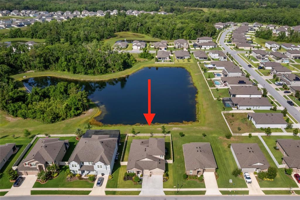 18428 Malinche Loop Spring Hill, FL 34610 - Photo 2 of 62 an aerial view of residential houses with outdoor space and parking