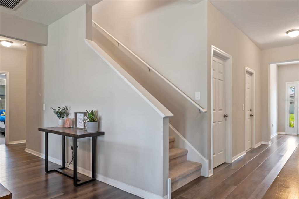 18428 Malinche Loop Spring Hill, FL 34610 - Photo 21 of 62 a view of entryway with wooden floor