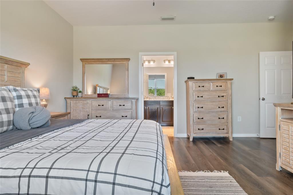 18428 Malinche Loop Spring Hill, FL 34610 - Photo 23 of 62 a bedroom with a bed and a closet