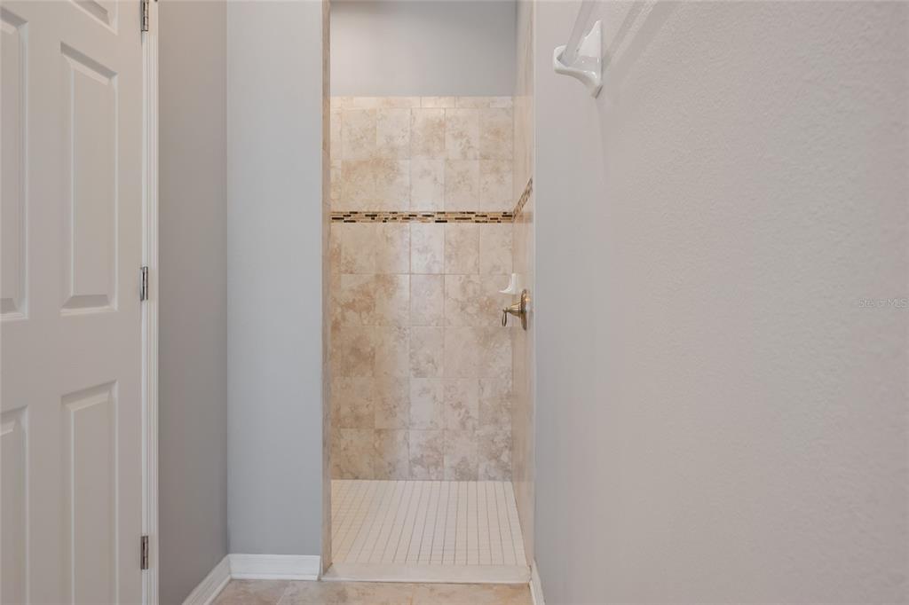 18428 Malinche Loop Spring Hill, FL 34610 - Photo 26 of 62 a bathroom with a shower