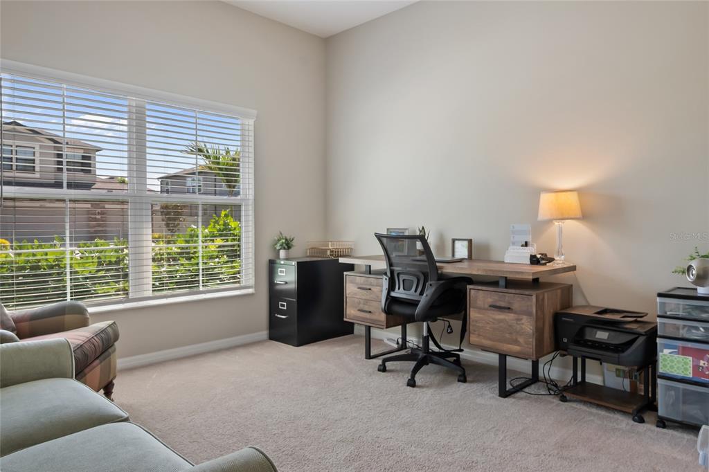 18428 Malinche Loop Spring Hill, FL 34610 - Photo 30 of 62 a workspace with furniture and a window