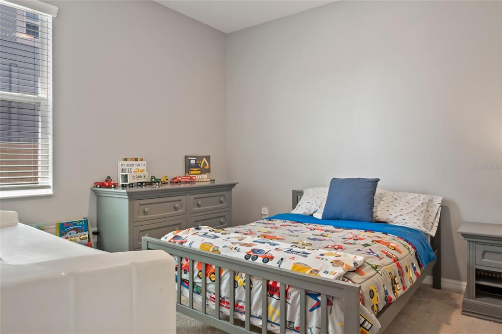 18428 Malinche Loop Spring Hill, FL 34610 - Photo 35 of 62 a bedroom with a bed and a window