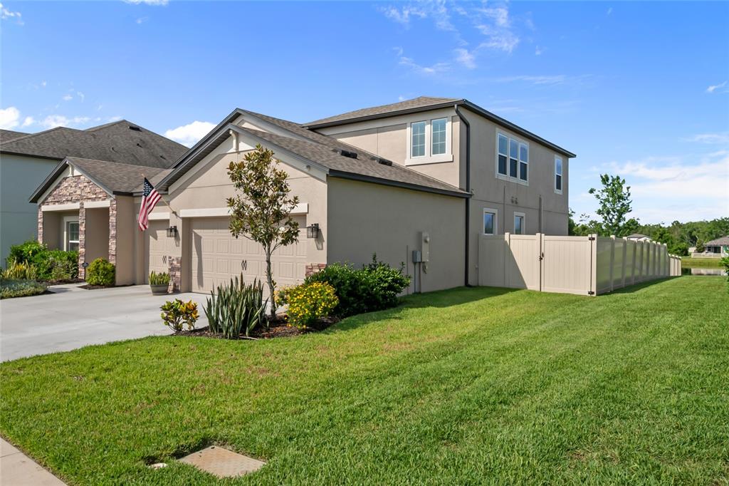 18428 Malinche Loop Spring Hill, FL 34610 - Photo 40 of 62 front view of a house with a yard