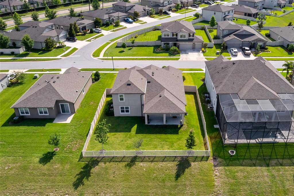 18428 Malinche Loop Spring Hill, FL 34610 - Photo 41 of 62 an aerial view of a house with a swimming pool