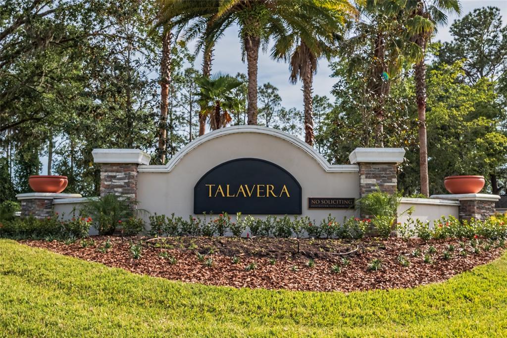 18428 Malinche Loop Spring Hill, FL 34610 - Photo 61 of 62 a front view of a house with garden