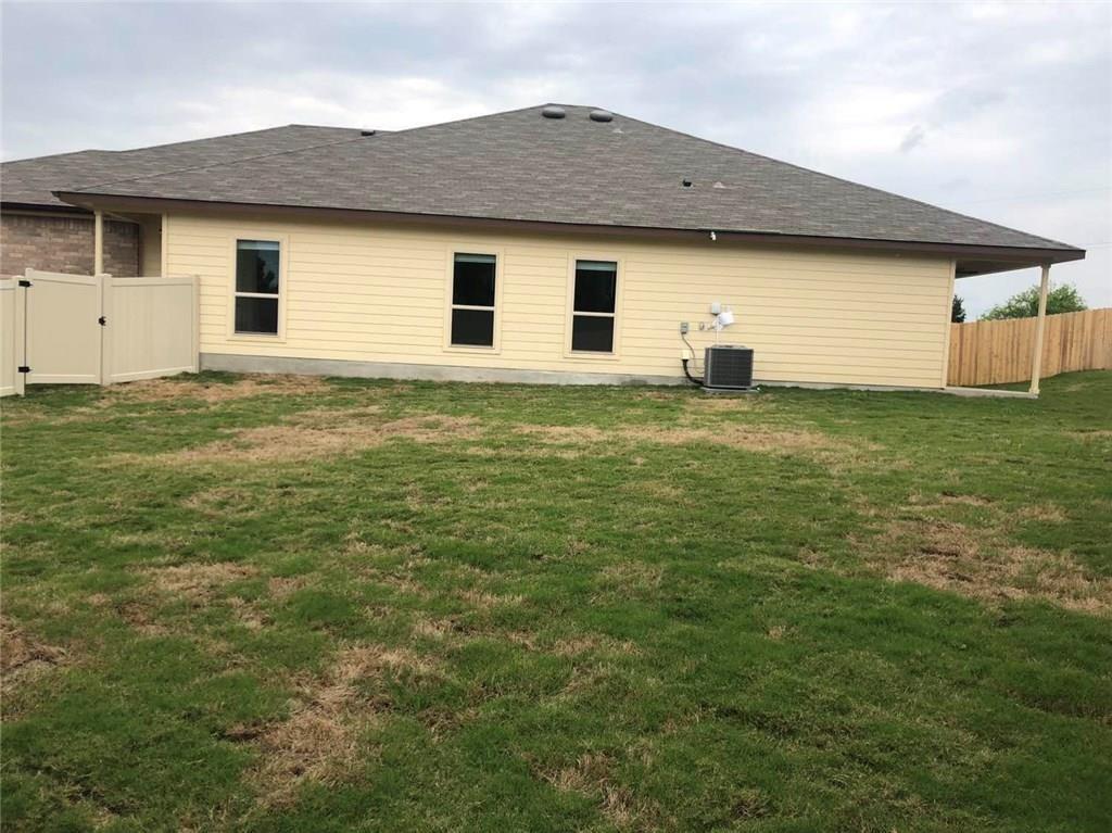 351 Joanne Loop, Unit A Buda, TX 78610 - Photo 14 of 17 A fenced backyard offers a secure and private outdoor setting.