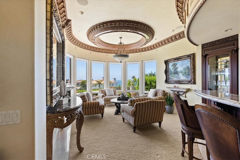 60 Ritz Cove Drive Dana Point, CA 92629 - Photo 17 of 74 Wet Bar and Sitting Area with lovely windows to take in those ocean views!