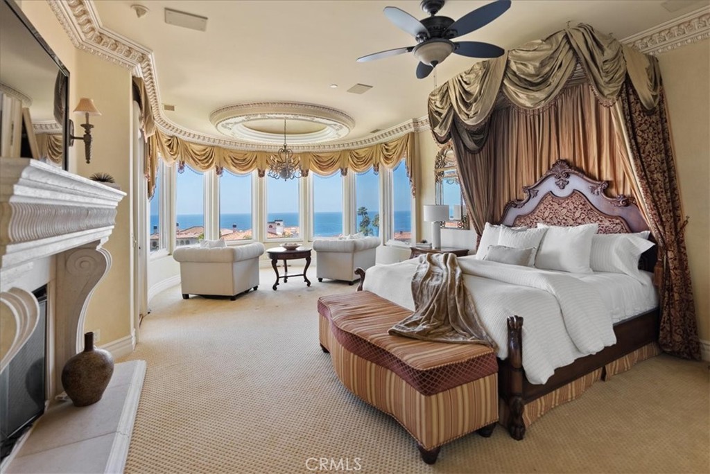 60 Ritz Cove Drive Dana Point, CA 92629 - Photo 38 of 74 Primary Bedroom is incredibly spacious and includes fireplace, sitting room, and deck with ocean views!