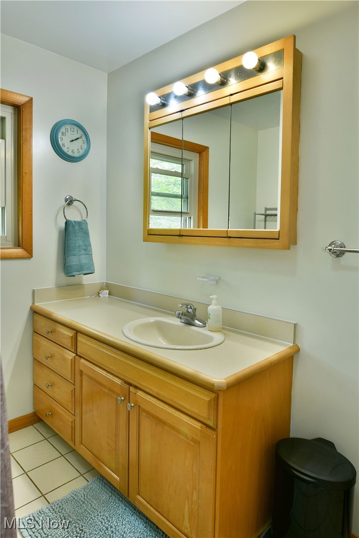 2907 Bushnell Campbell Road Fowler, OH 44418 - Photo 19 of 49 Bathroom featuring vanity and tile patterned floors