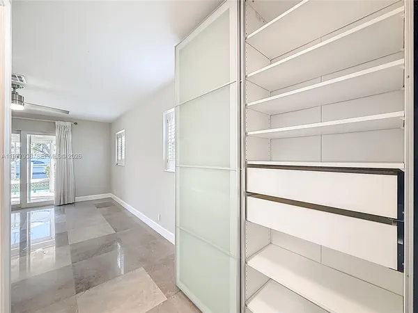 a view of a living room and front door