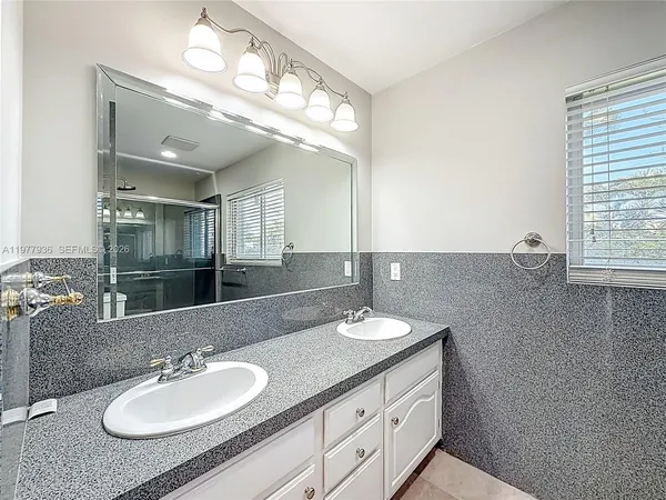 a large room with wooden floor and windows