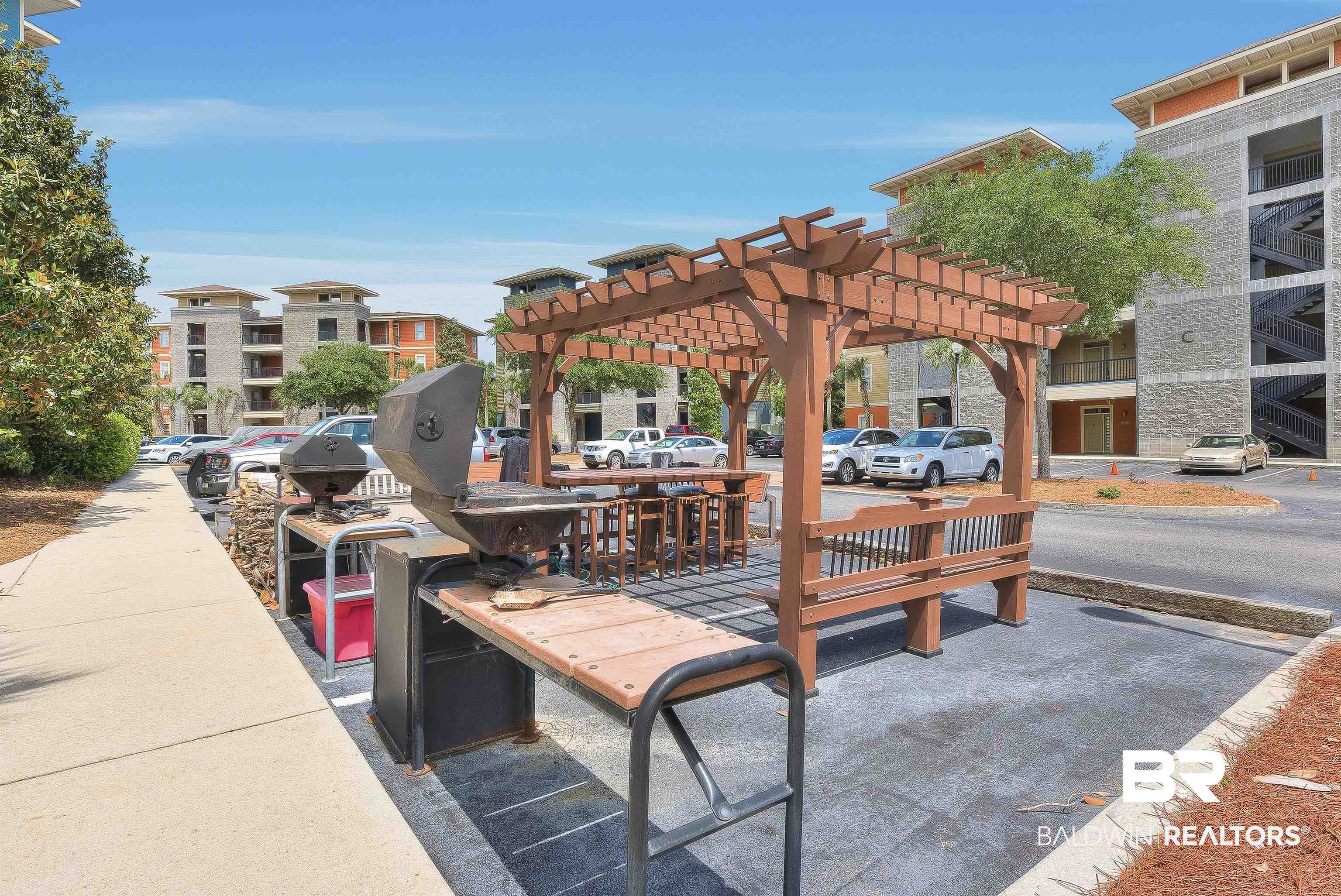 1430 West Regency Road, Unit I102 Gulf Shores, AL 36542 - Photo 28 of 31 Charcoal Bar-b-Q Grills with a pergola