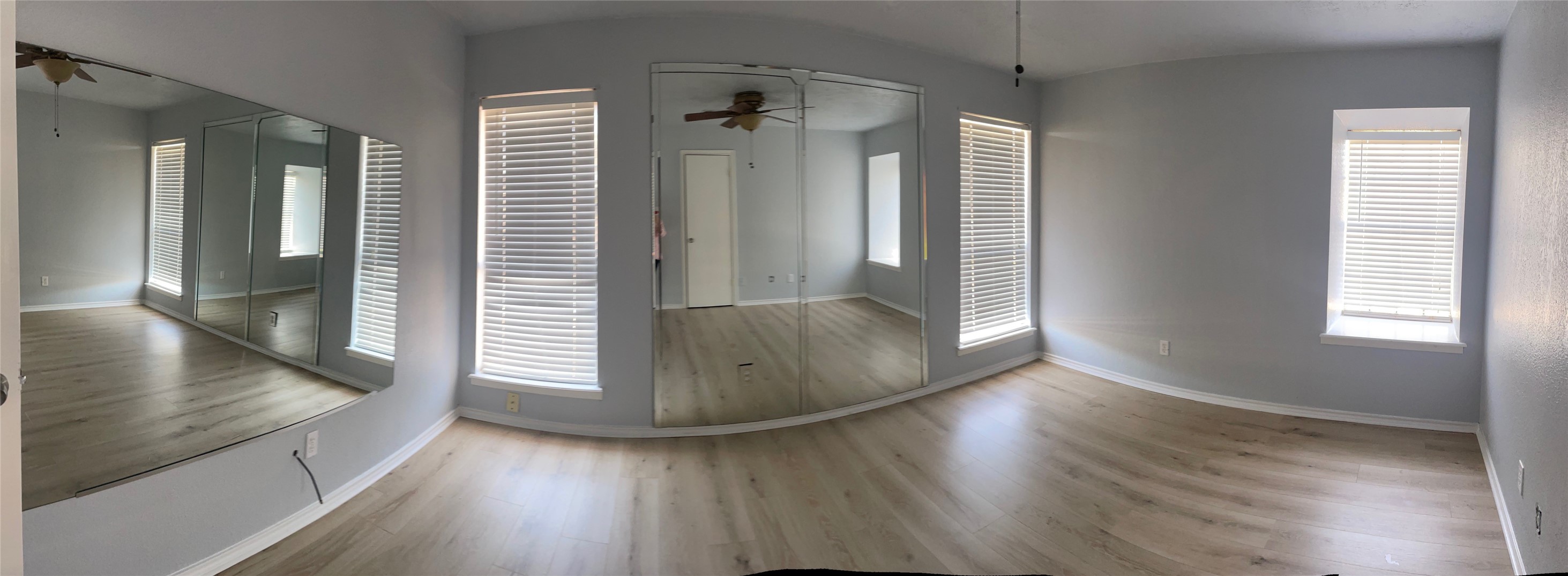9250 Beechnut Street, Unit 21 Houston, TX 77036 - Photo 1 of 18 wooden floor in an empty room with a window