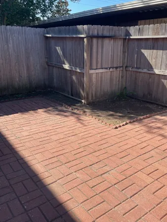 a view of outdoor space with wooden fence