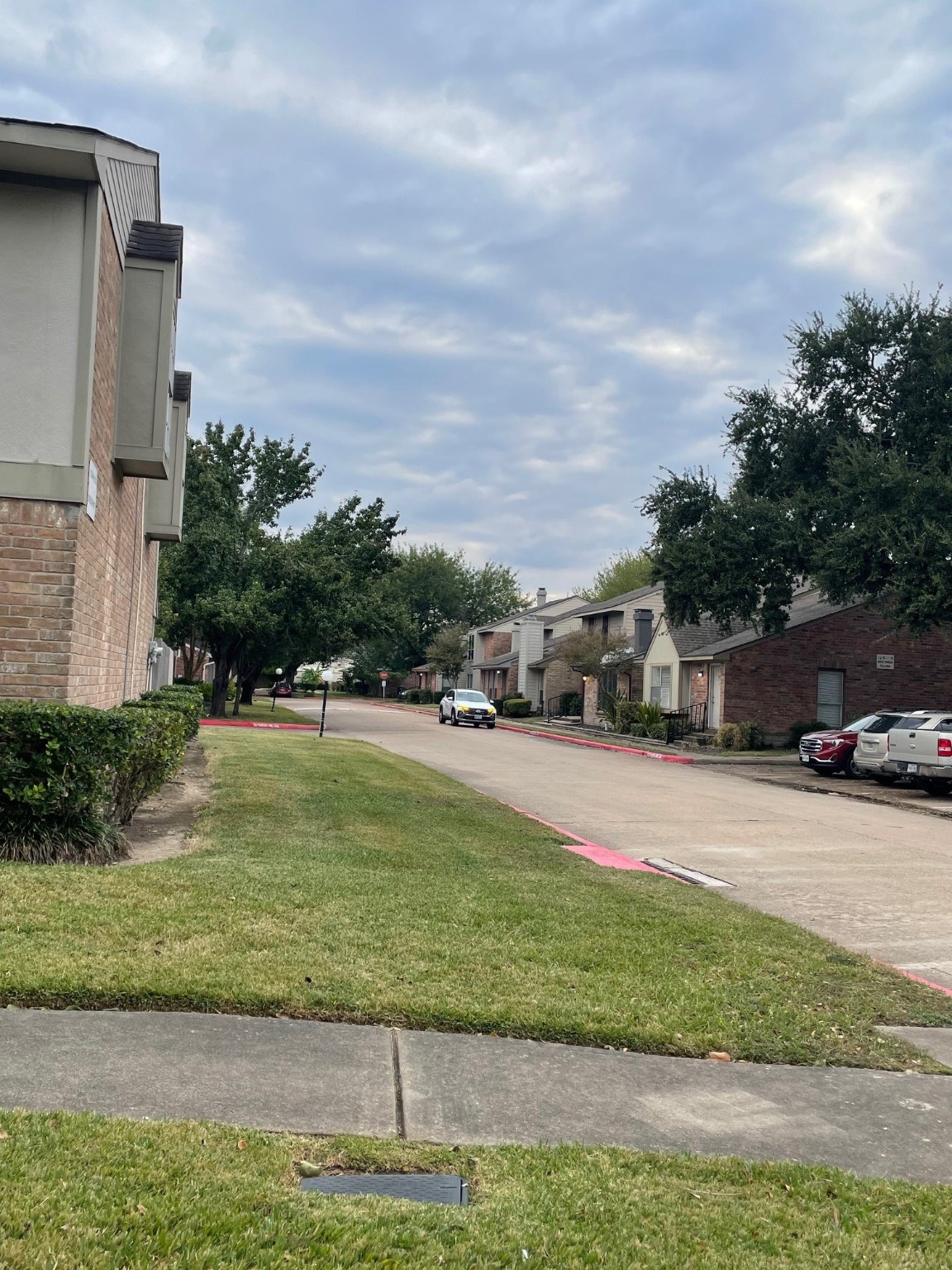 9250 Beechnut Street, Unit 21 Houston, TX 77036 - Photo 2 of 18 a front view of a house with a yard