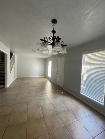 a view of a kitchen with a sink and a window