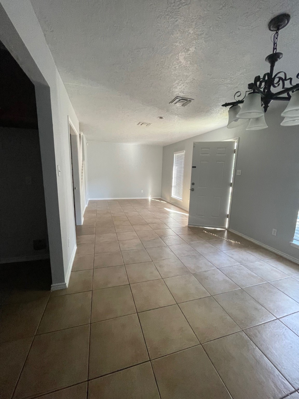 9250 Beechnut Street, Unit 21 Houston, TX 77036 - Photo 6 of 18 a view of a livingroom and an empty room