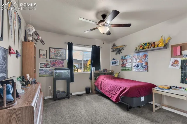a bedroom with a bed furniture and window