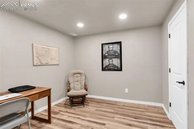 a bedroom with a workspace