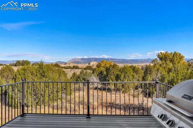 a view of a balcony with wooden fence