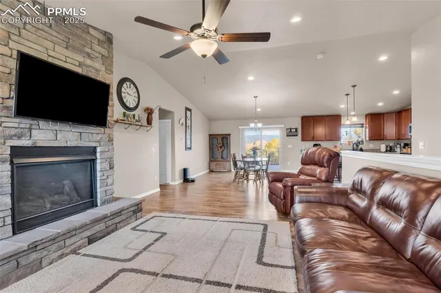 a living room with fireplace furniture and a flat screen tv