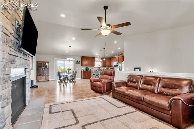 a living room with furniture and a fireplace